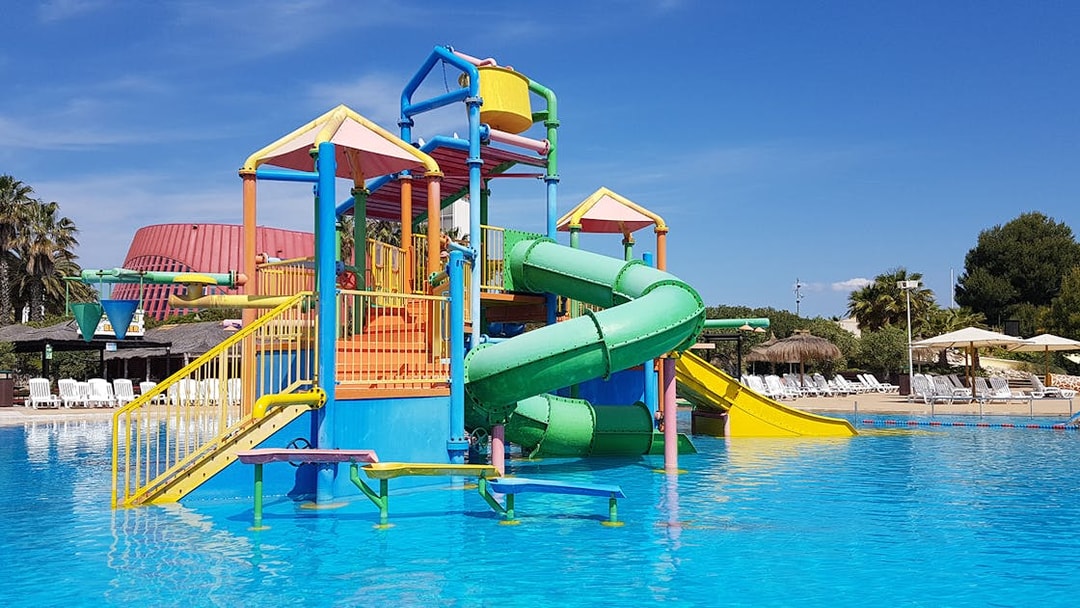 Colorful water play structure with slides at Aquopolis Costa Daurada.