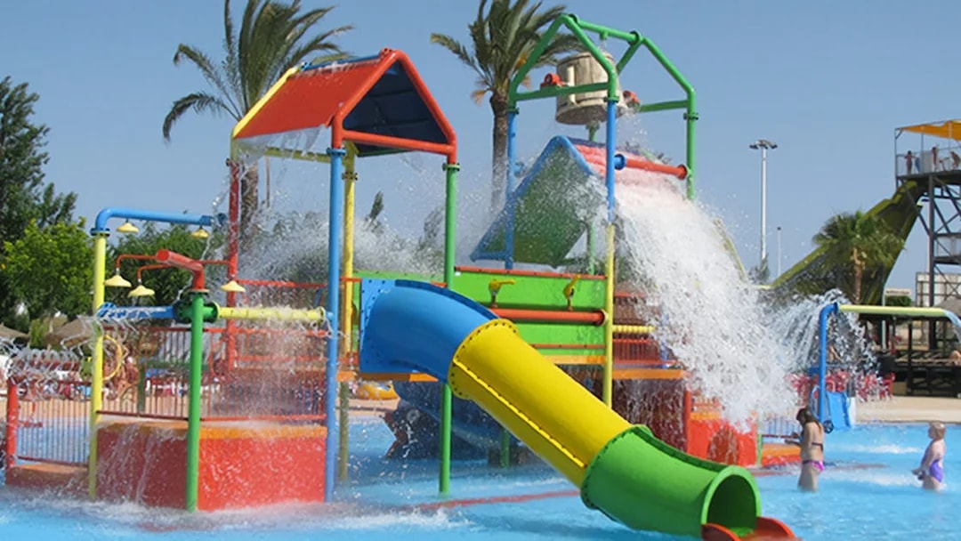 Colorful water playground with slides and fountains at Aquopolis Torrevieja.