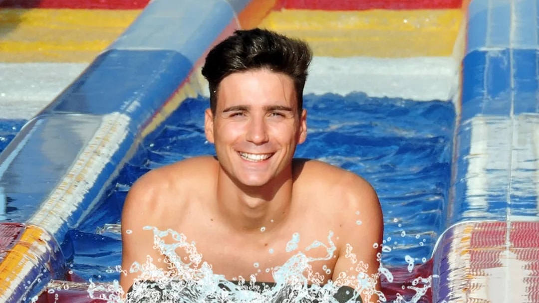 Man enjoying a water slide at Aquopolis Torrevieja.