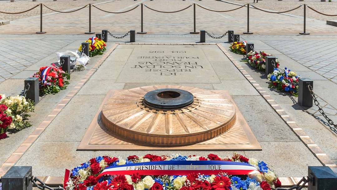 Tomb of the Soldier with eternal flame and wreaths at the Arc de Triomphe, Paris.