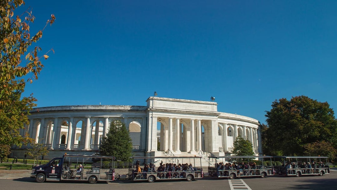 Tour tram in front of Arlington Memorial Amphitheater at Arlington National Cemetery.