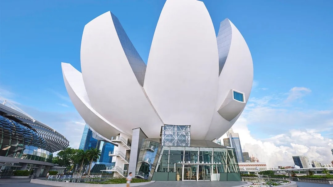 ArtScience Museum lotus-shaped building in Singapore against blue sky.