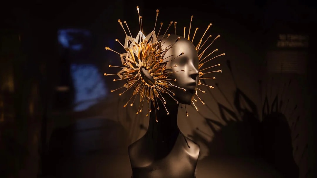Sculpture with intricate gold spikes at ArtScience Museum exhibit.