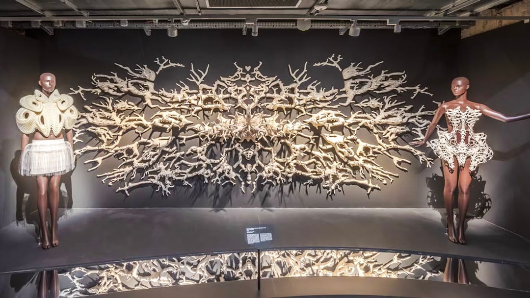 Mannequins in intricate designs at ArtScience Museum exhibit, Singapore.