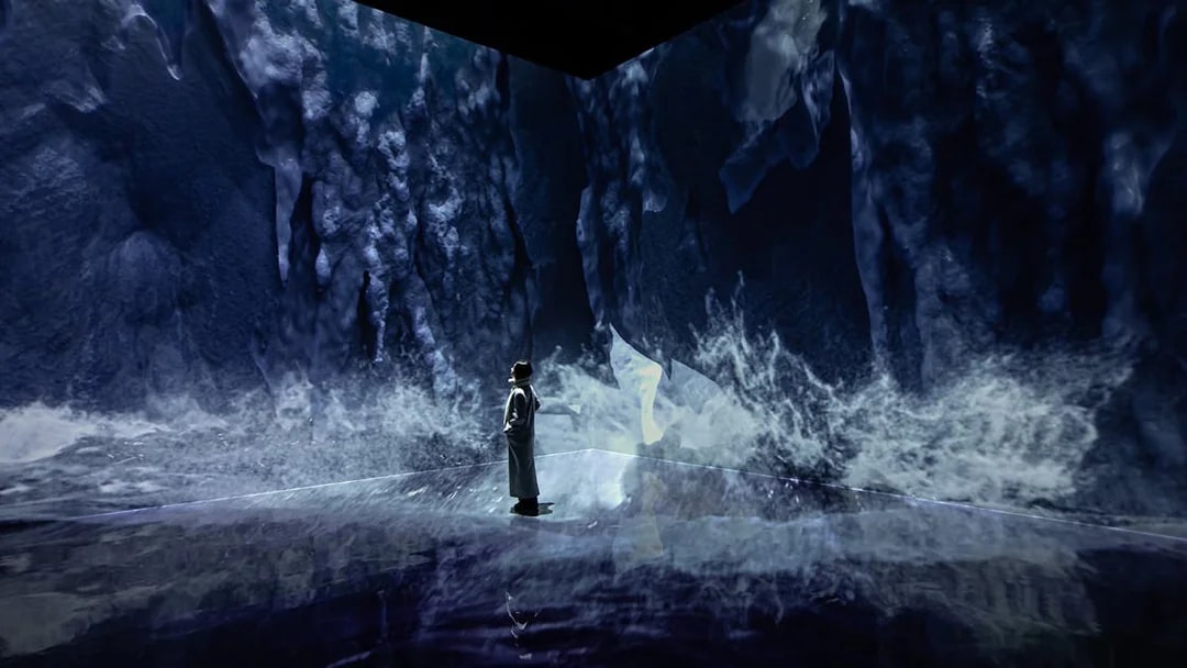 Visitor exploring ice-themed digital art at ARTE MUSEUM DUBAI exhibit.