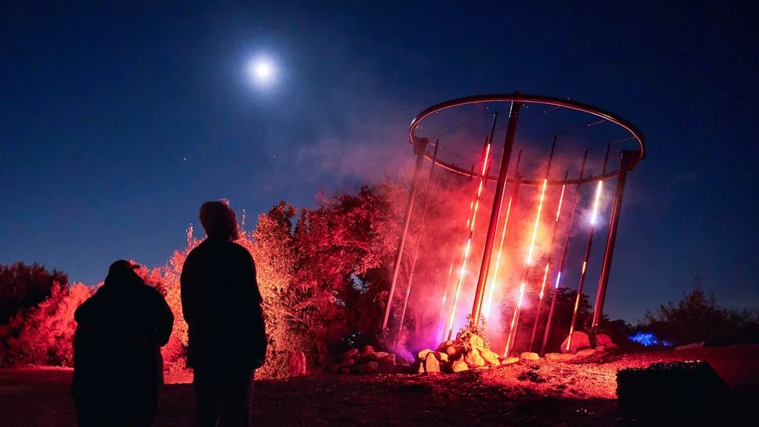 Guests viewing illuminated display at Astra Lumina, Currumbin Wildlife Sanctuary.