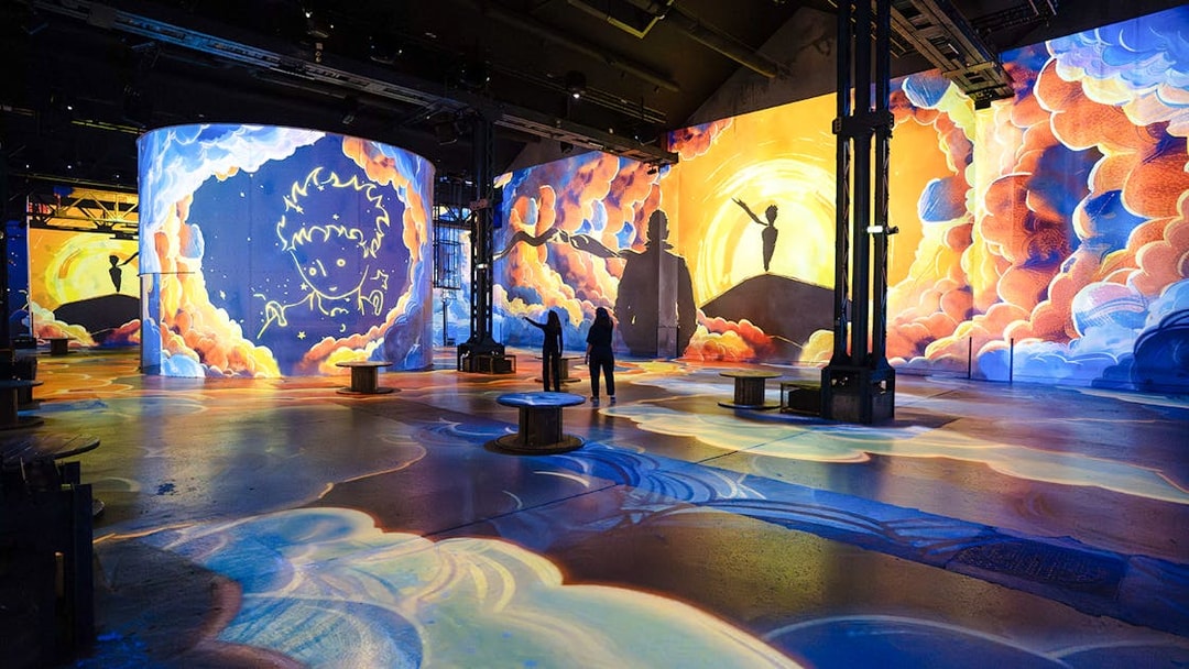 Visitors at the Little Prince exhibition, Atelier Des Lumières, Paris, France.