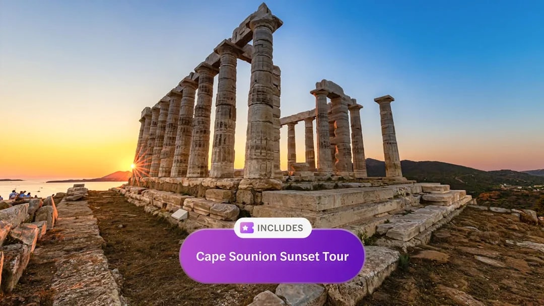 Sunset view at the Temple of Poseidon, Cape Sounion, with sea and hills in the background.