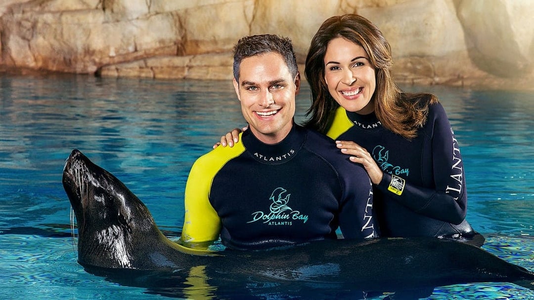 Couple with sea lion at Dolphin Bay, Atlantis Dubai.