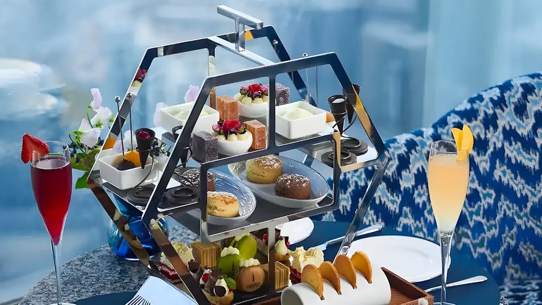 Afternoon tea set with pastries and drinks at At.mosphere Burj Khalifa, Dubai.