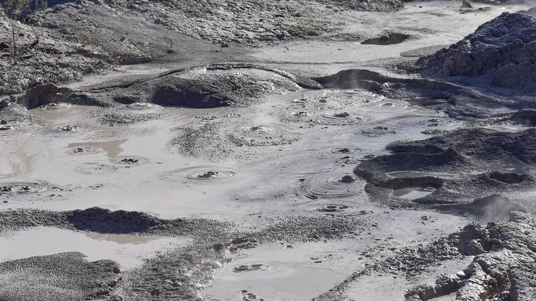 Bubbling mud pools at Wai-O-Tapu geothermal area near Rotorua, New Zealand.