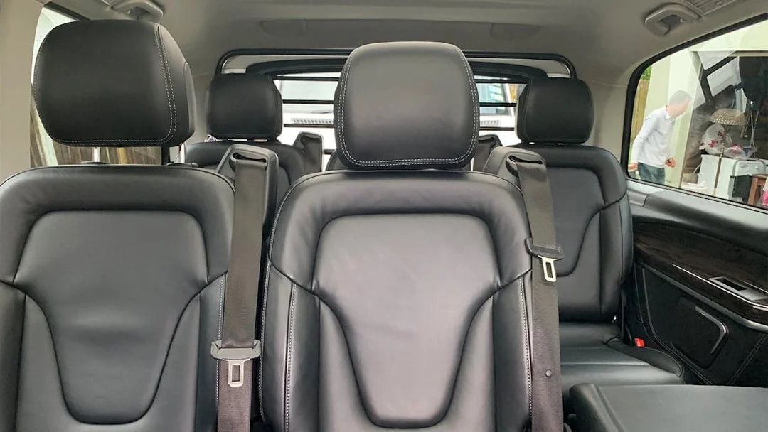 Luxury vehicle interior for Auckland to Hobbiton, Waitomo Caves, Te Puia transfer.