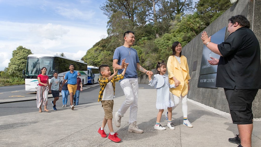 Tour group arriving at Hobbiton Movie Set visitor center, Auckland.