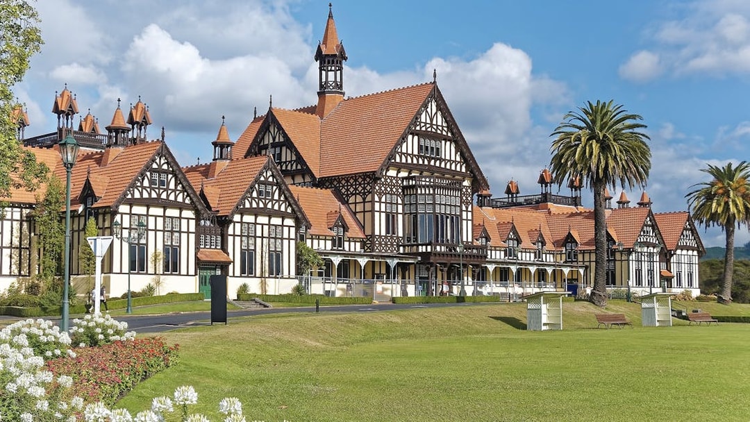 Tudor-style Rotorua Museum in Government Gardens, part of Rotorua Highlights Tour from Auckland.