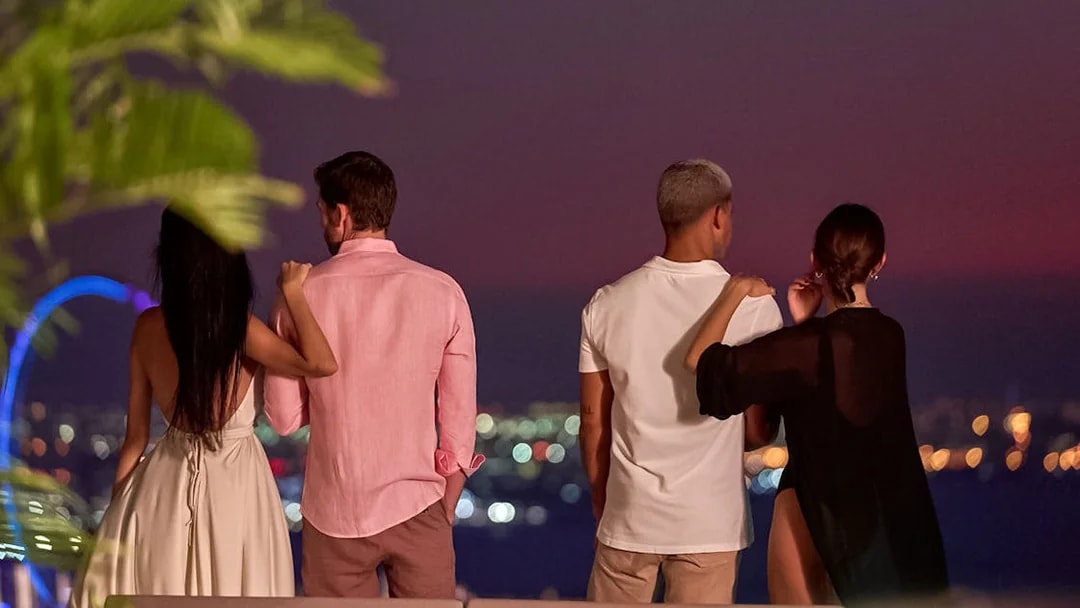 Tourists enjoying Palm Jumeirah view from Aura Sky Pool, Dubai.