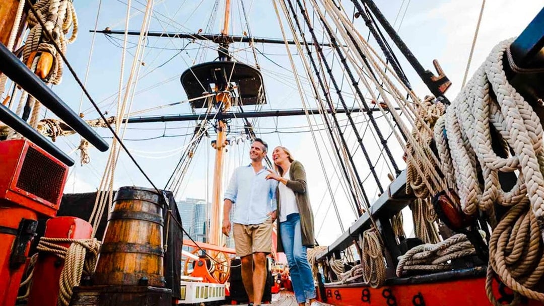 Couple exploring historic ship at Australian National Maritime Museum, Sydney.