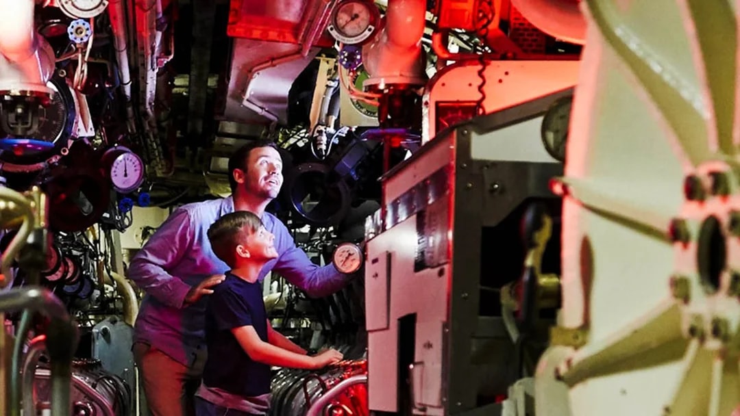 Visitors exploring submarine interior at Australian National Maritime Museum, Sydney.