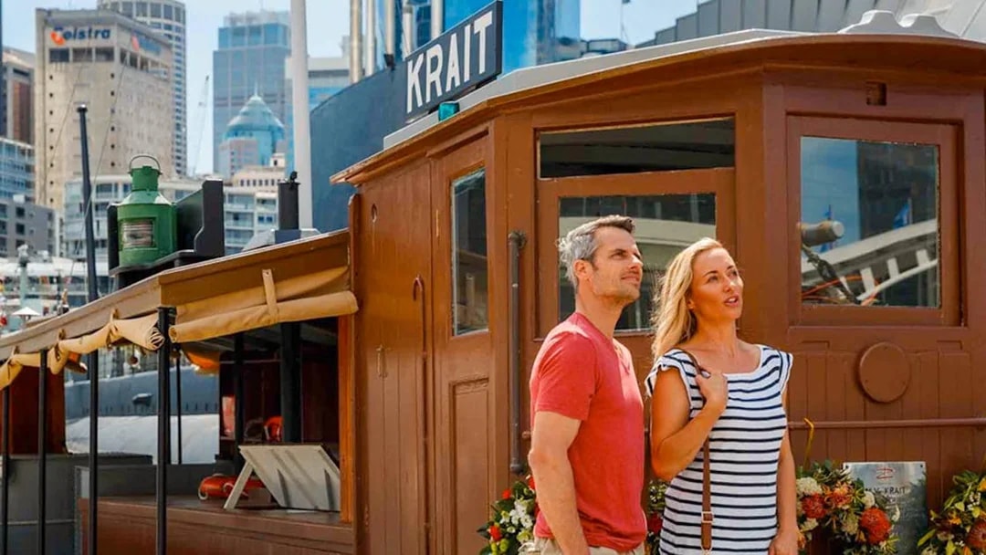 Couple exploring the Krait vessel at the Australian National Maritime Museum, Sydney.
