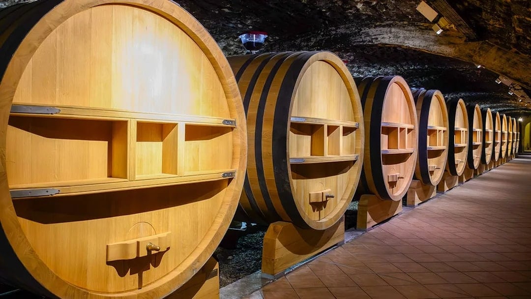 Barrels in underground wine cellars, Chateauneuf-du-Pape, Provence.