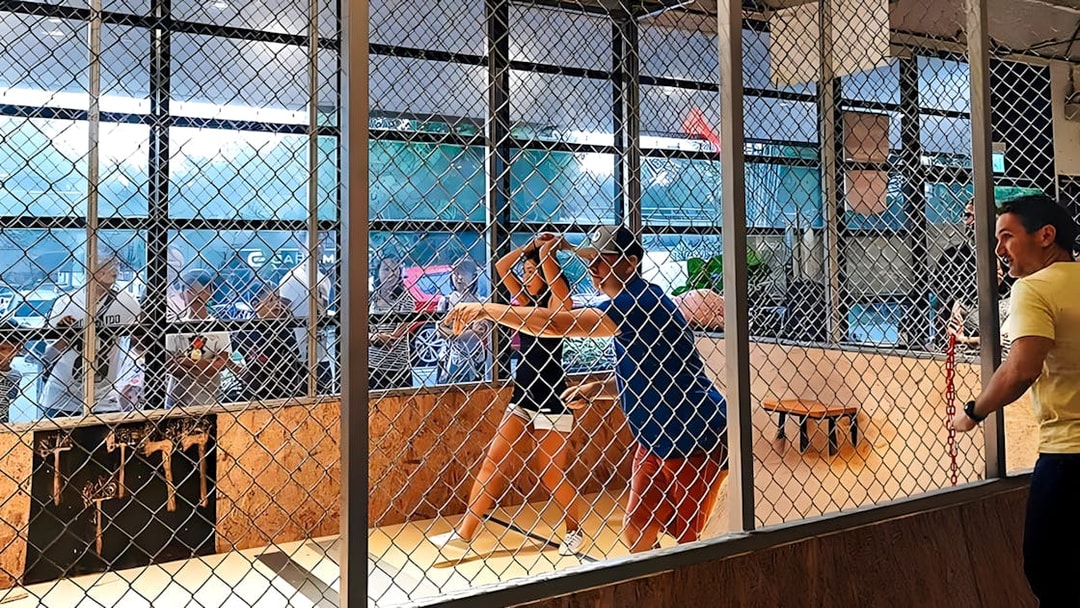 People axe throwing at Axe Factor in Sentosa.