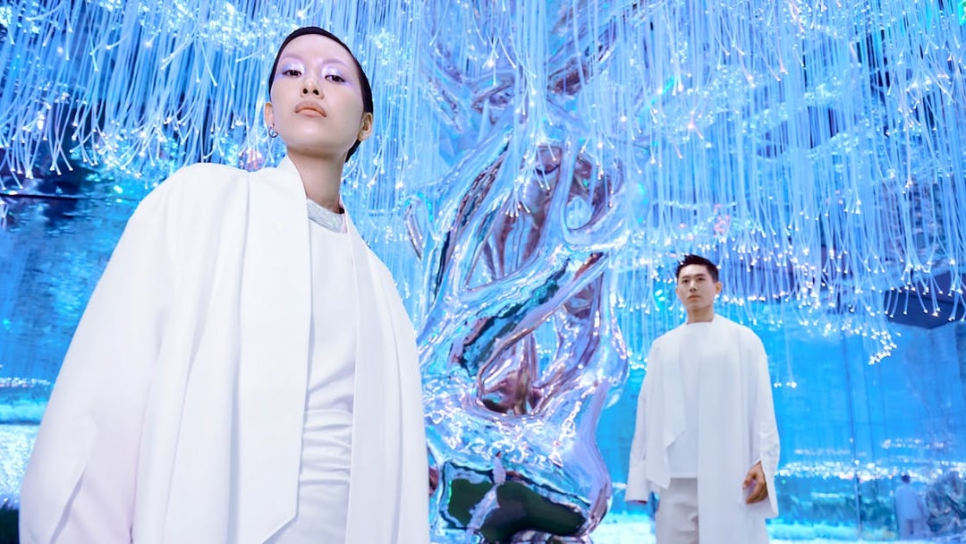 People exploring the illuminated Flora Zone in AYA Universe, Dubai.