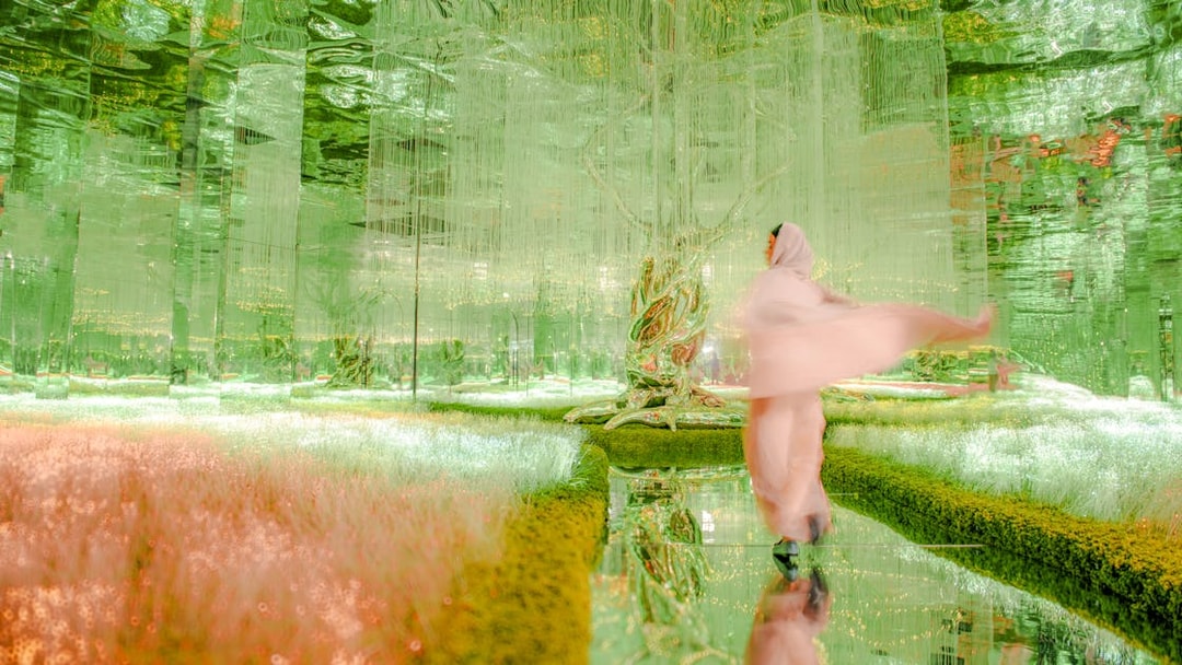 Visitor exploring the vibrant Flora zone at AYA Universe, Dubai.