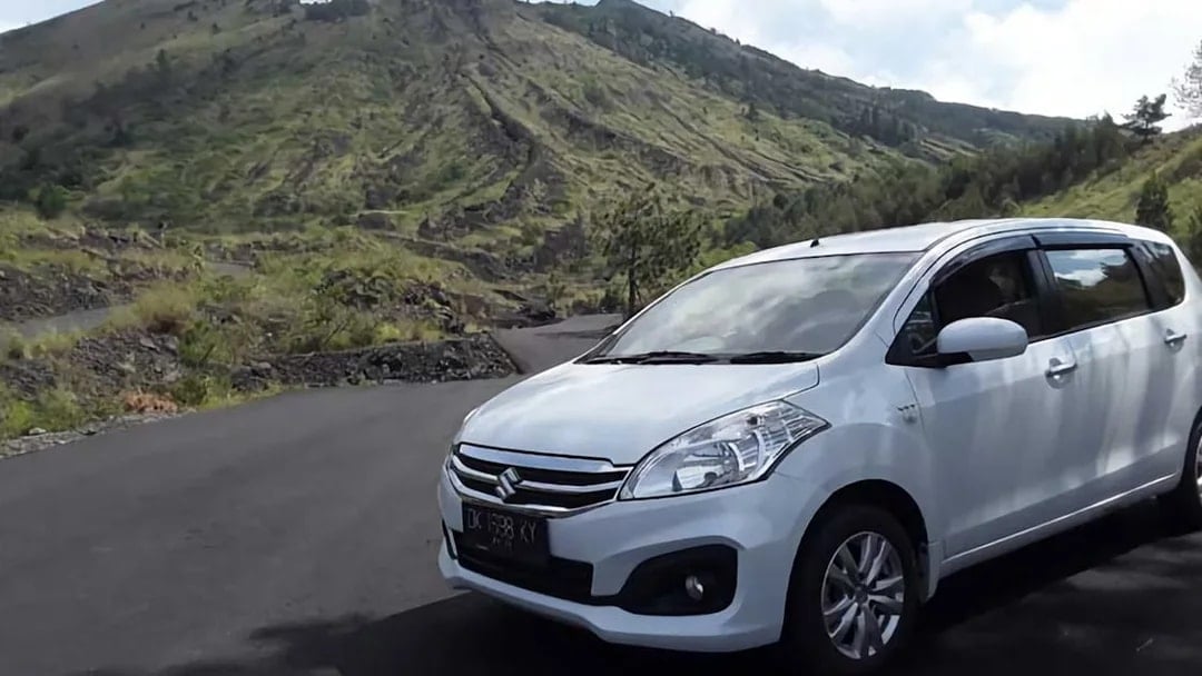 Private car with driver on a scenic road in Bali, Indonesia.