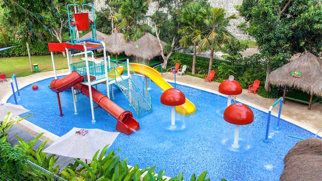 Children's water play area with slides at Bali Zoo.