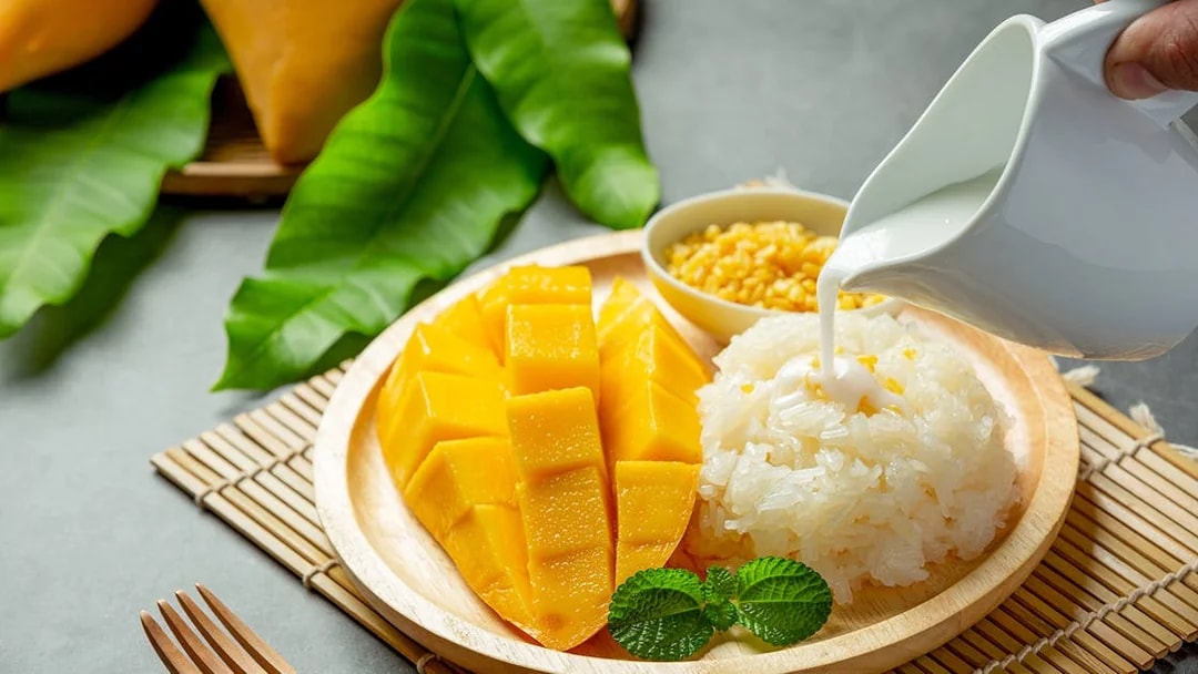 Mango sticky rice dessert with coconut milk, Bangkok tour.