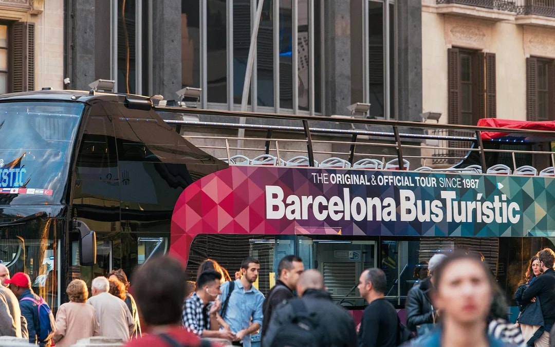 Barcelona Bus Turistic with passengers boarding for a city tour.