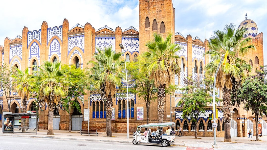Tuk tuk in front of the historic Plaza de Toros Monumental in Barcelona.