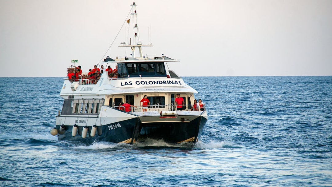 Las Golondrinas boat with passengers on a sea trip.