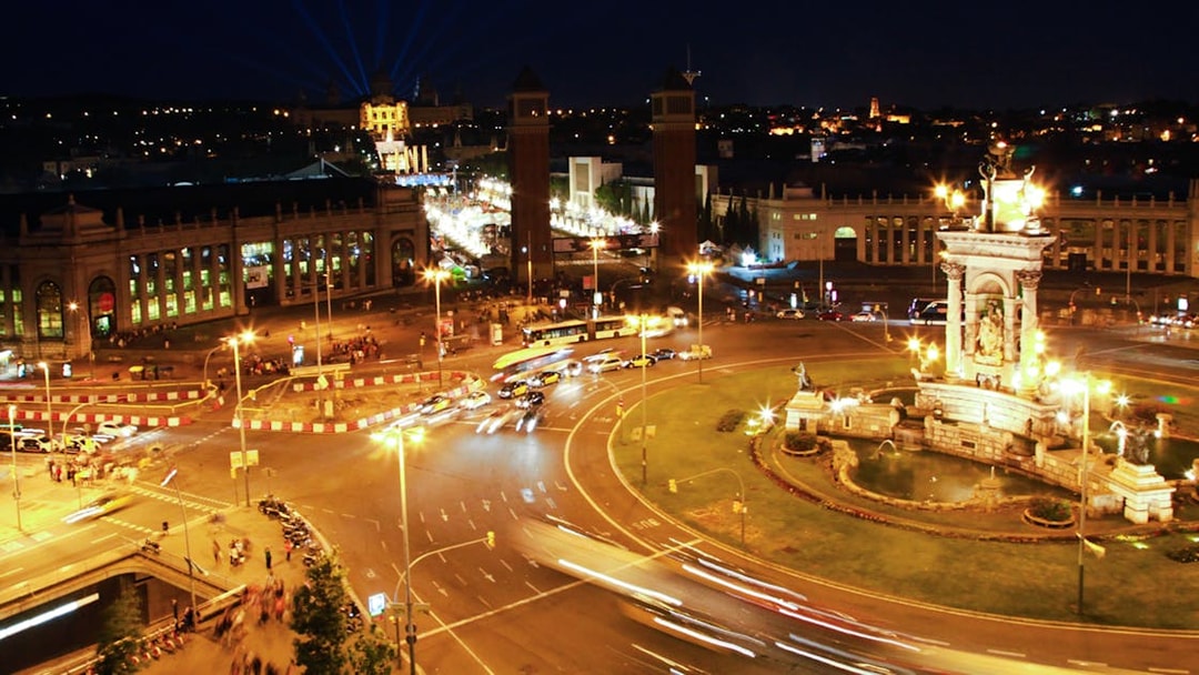 Barcelona's Plaça d'Espanya illuminated at night during a city tour.