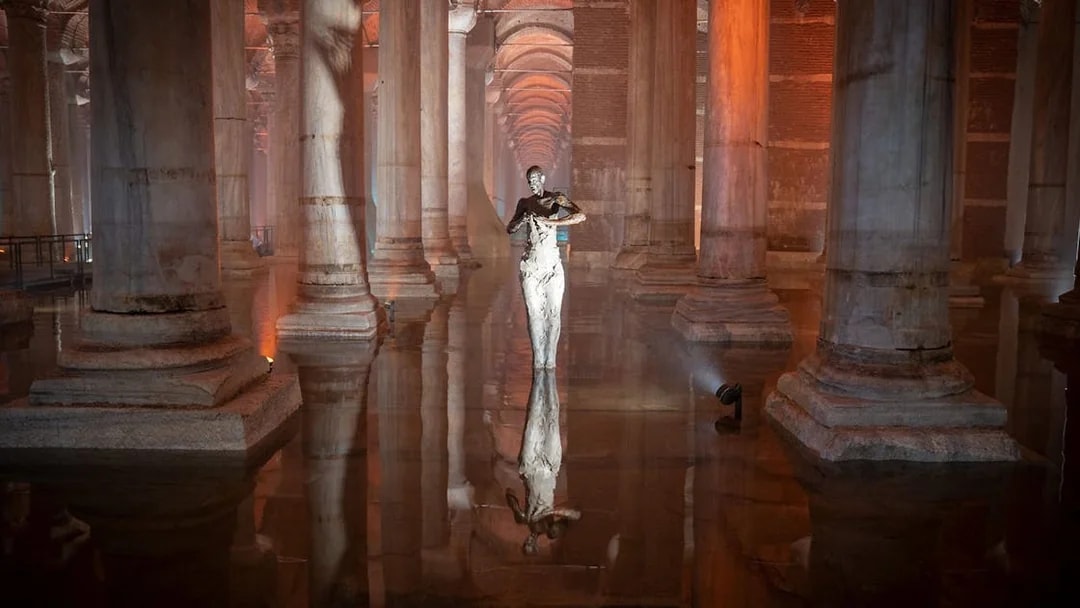 Basilica Cistern interior with columns and reflective water during guided tour in Istanbul.