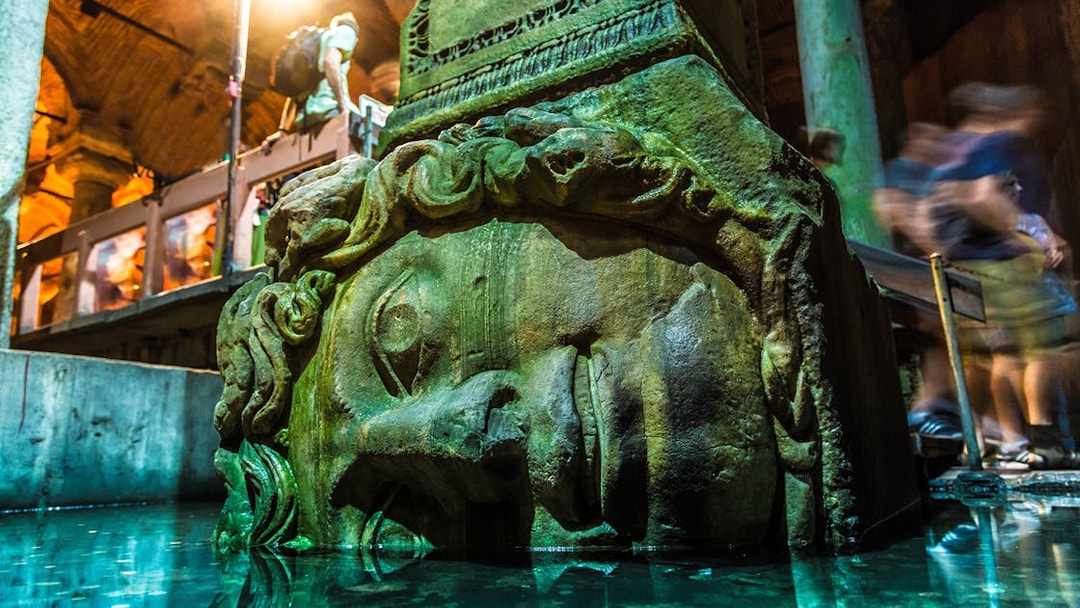 Medusa head column in Basilica Cistern, Istanbul, part of Blue Mosque & Basilica Cistern tour.