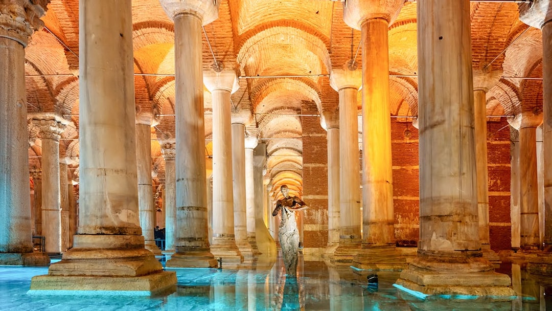 Pillars inside the Basilica Cistern in Istanbul with reflections on the water.