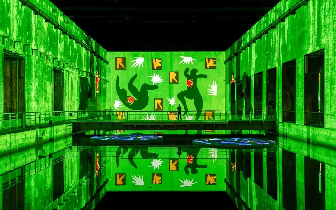 Matisse artwork projected in green at Bassins des Lumières exhibition.