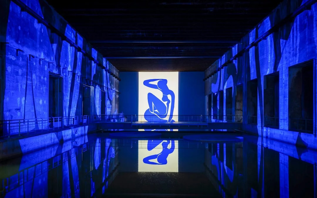 Matisse artwork projected in blue at Bassins des Lumières exhibition.