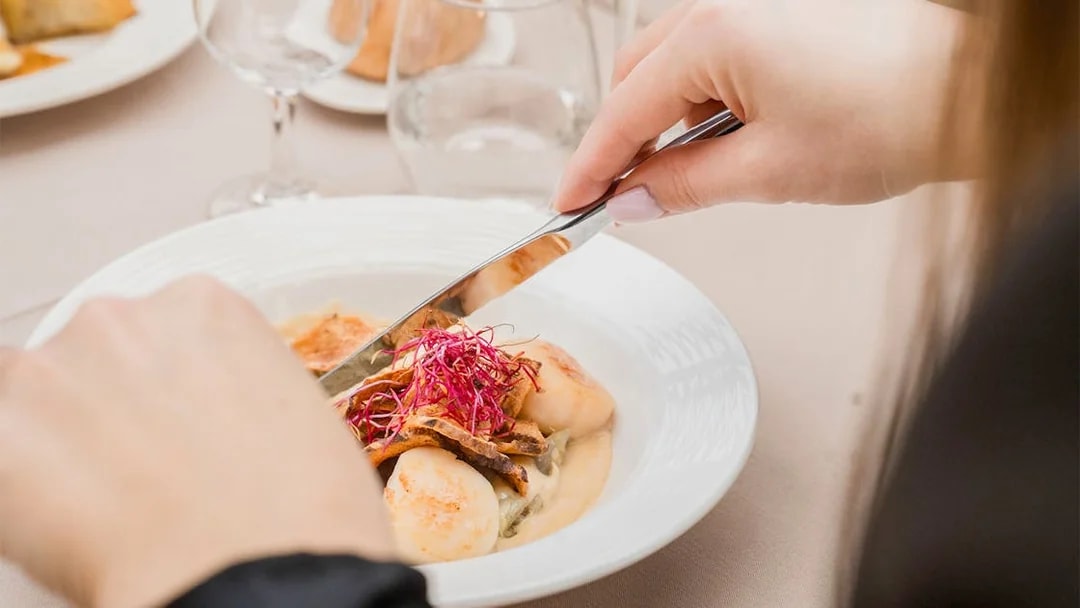Dining on French cuisine during Seine River cruise in Paris.