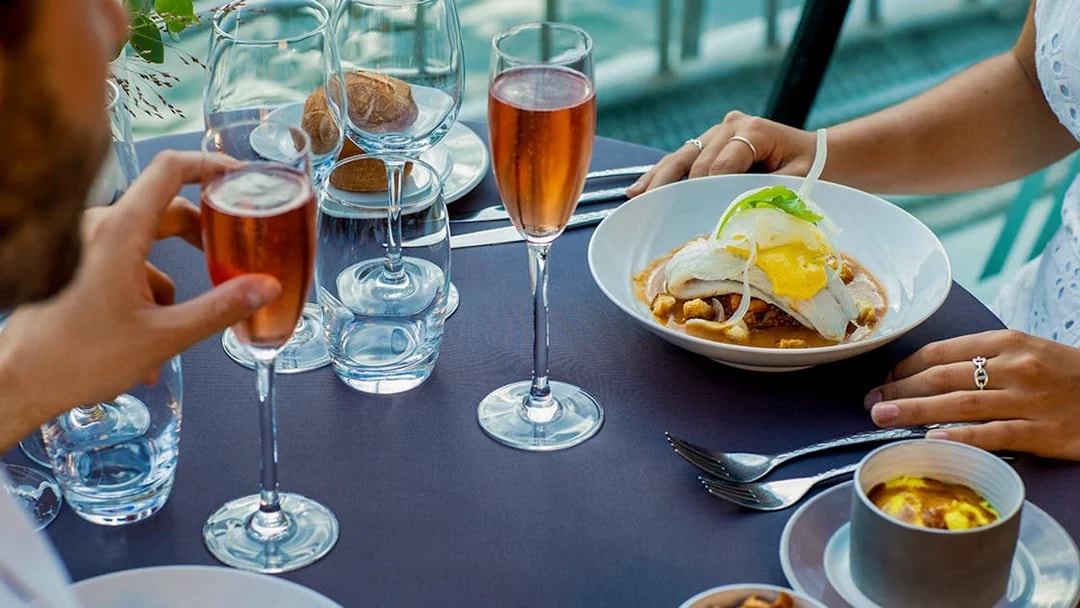 Dinner setting on a Seine River cruise with gourmet dishes and champagne at 6:15pm.