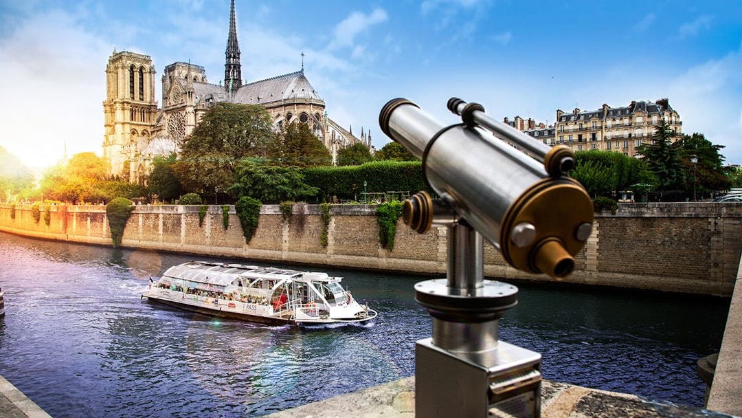 Batobus cruising on the Seine River near Notre-Dame Cathedral in Paris.