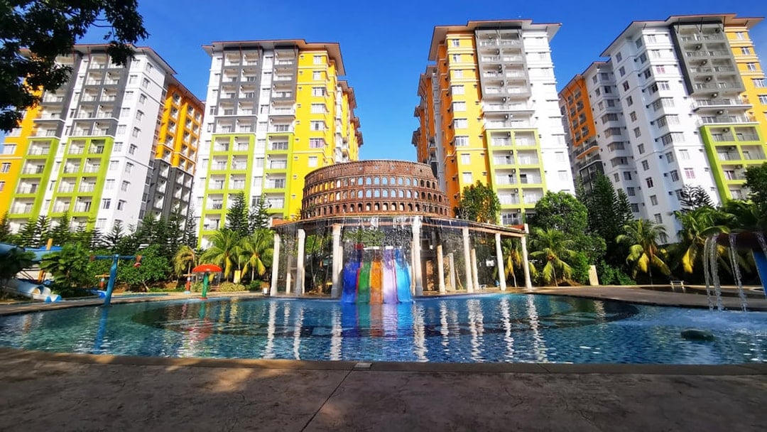 Bayou Lagoon Water Park with colorful slides and tall buildings in the background.