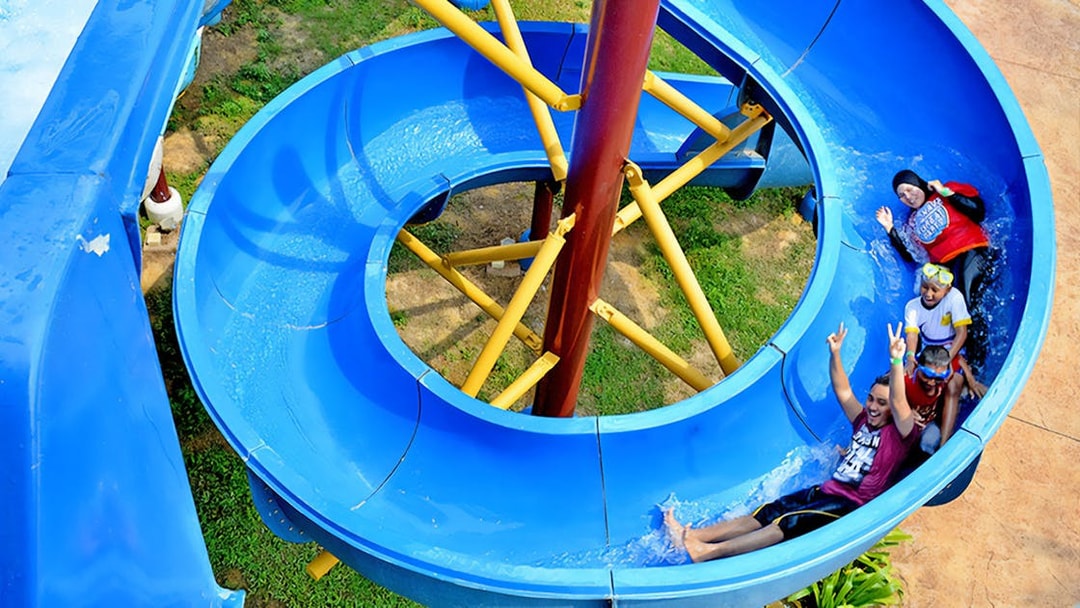 Visitors enjoying a water slide at Bayou Lagoon Water Park.