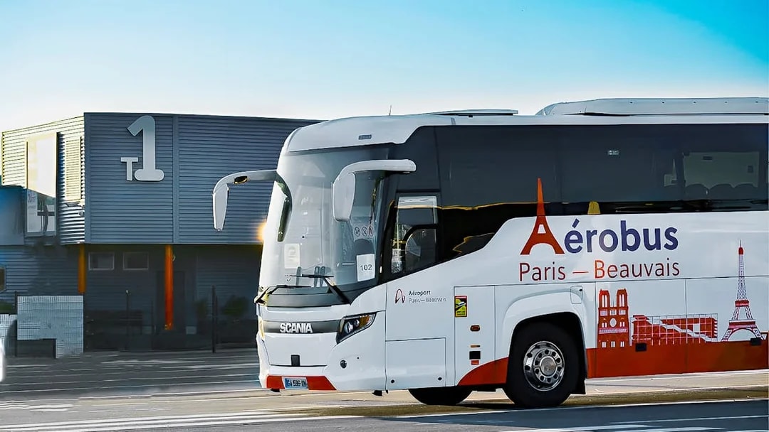 Shuttle bus at Beauvais Airport offering round-trip service to Paris.