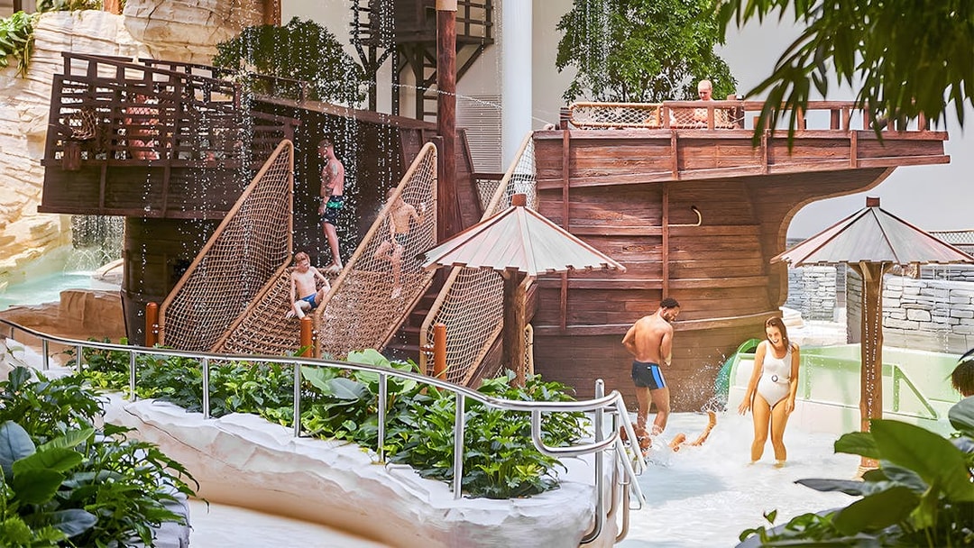 Bellewaerde Aquapark visitors enjoying water play area with wooden ship structure in Ypres.