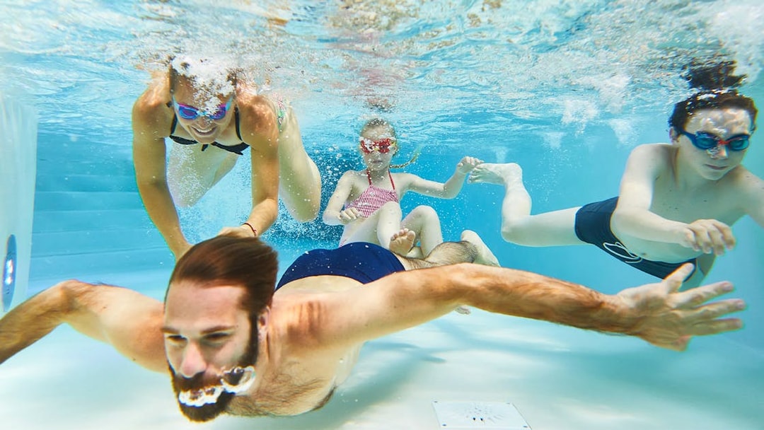 Tourists swimming underwater at Bellewaerde Aquapark.