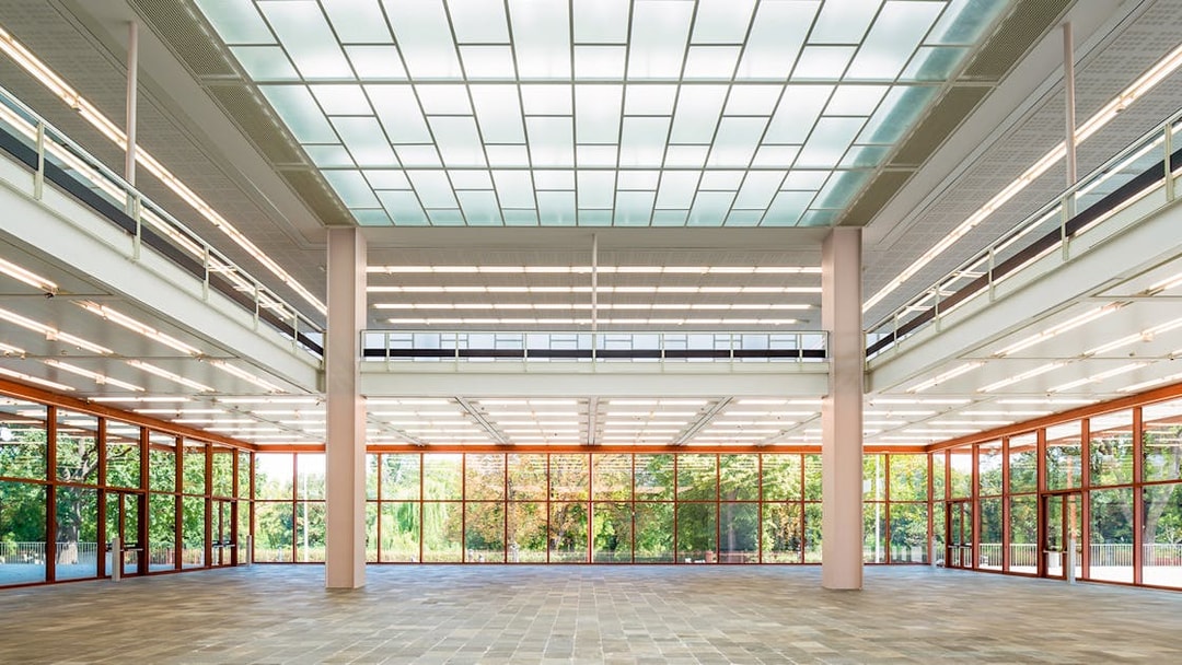 Spacious interior of Belvedere 21 Museum of Contemporary Art with large windows and modern design.