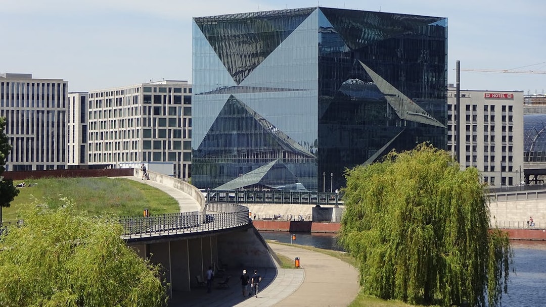 Modern glass building along the River Spree in Berlin, seen from a sightseeing cruise.