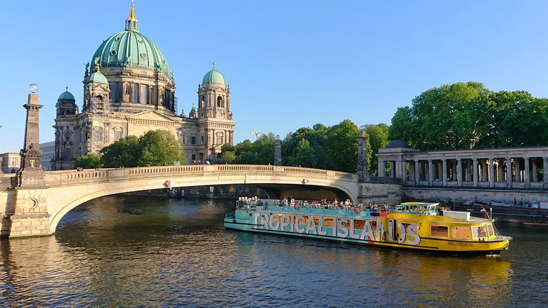 Sightseeing cruise boat near Berlin Cathedral on the Spree River, East-Side-Tour.