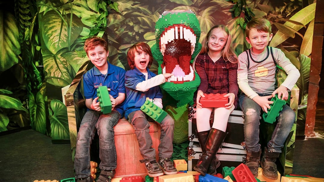 Kids with Lego dinosaur at Berlin Legoland Discovery Centre.